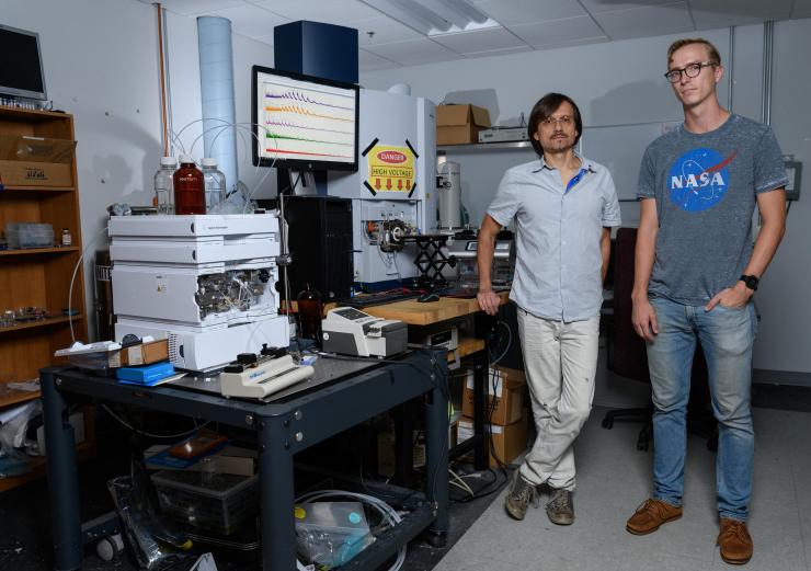 <p>Georgia Tech researchers Andrei Fedorov and Mason Chilmonczyk are shown in a testing laboratory used to evaluate their Dynamic Mass Spectrometry Probe, which was developed to monitor the health of living cell cultures. (Credit: Rob Felt, Georgia Tech)</p>