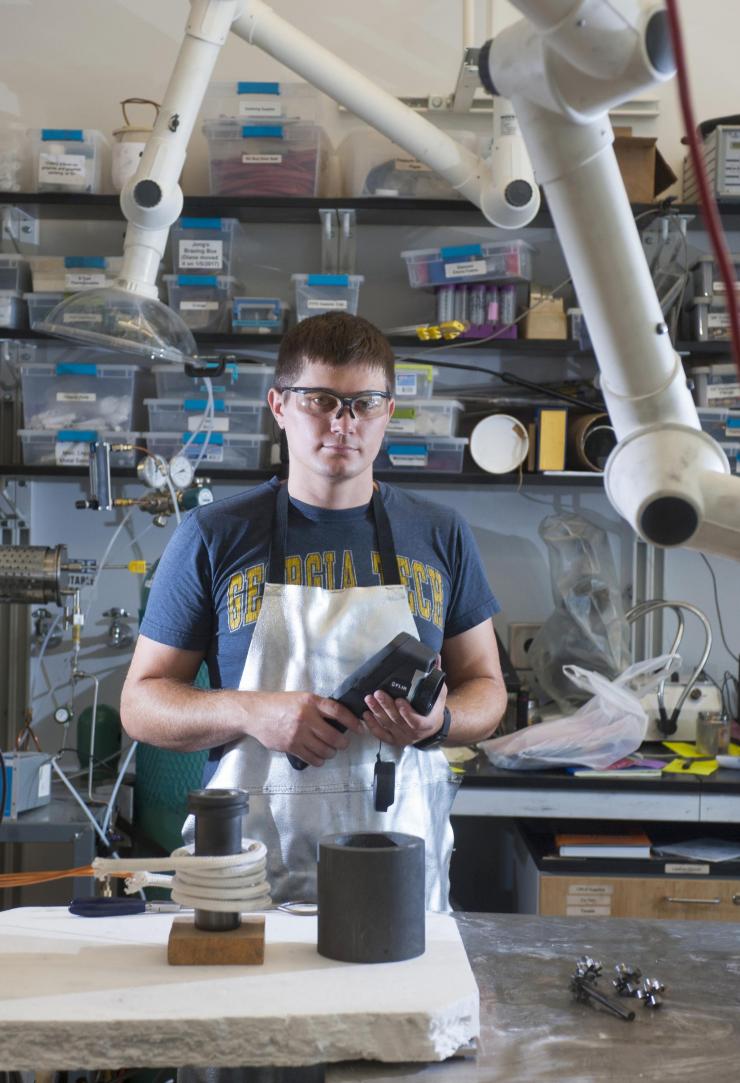 <p>Georgia Tech Graduate Student Caleb Amy holds an infrared camera for remotely measuring temperature, which was used in research on a ceramic-based pump able to operate at temperatures of more than 1,400 degrees Celsius. (Credit: Christopher Moore, Georgia Tech)</p>