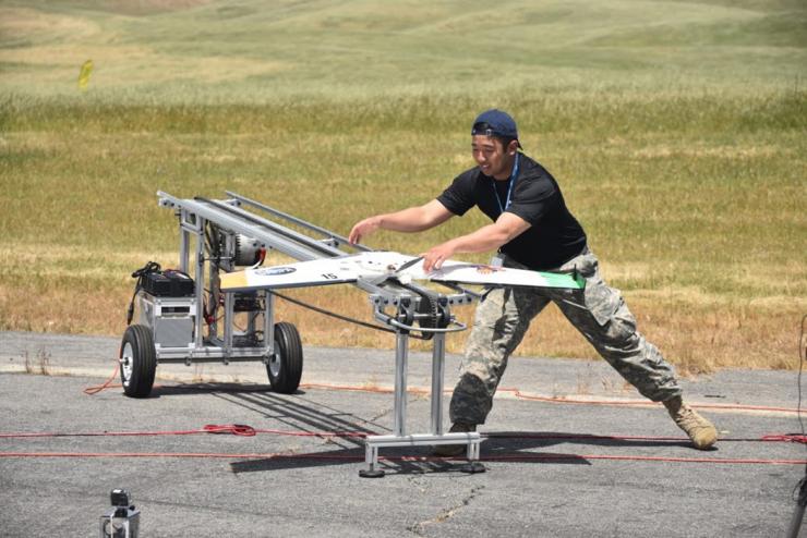 <p>A Marcus AV Zephyr is being prepared for launch at the Service Academies Swarm Challenge. (Credit: DARPA)</p>