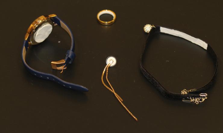 <p>Image shows potential contraceptive jewelry, in clockwise order, a pharmaceutical watch, ring, choker necklace and earring. In each case, a white contraceptive patch material is applied to a part of the jewelry that would be in contact with the skin. (Credit: Mark Prausnitz, Georgia Tech)</p>