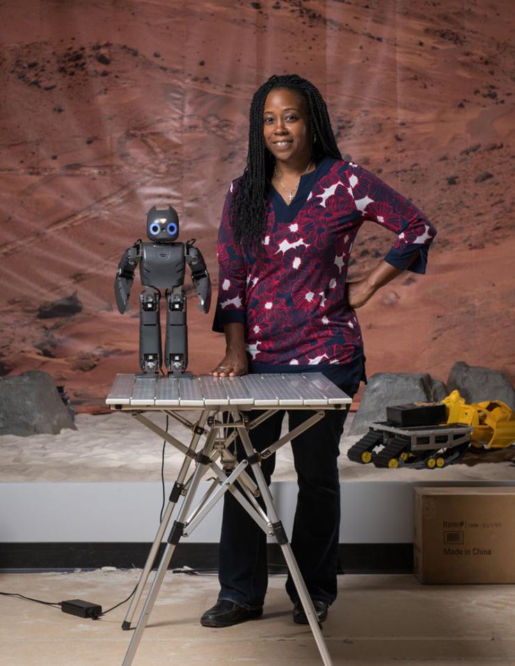 <p>Ayanna Howard, the two studies' principal investigator. Here, for a past study, she is using a socially engaging robot to interact with children who are having difficulty with mathematics. The robot uses knowledge from real teachers to help children with common math problems. Georgia Tech / Rob Felt</p>