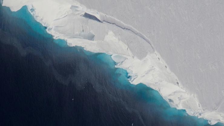 <p>Part of Thwaites Glacier crumbles into the ocean. It is part of the normal life of a glacier, but the rate of ice flow into the ocean of some Antarctic glaciers has markedly accelerated, raising concerns. Credit: NASA/OIB Jeremy Harbeck</p>
