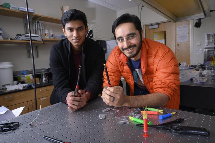 <p>Georgia Tech undergraduate student Gaurav Byagathvalli and Assistant Professor Saad Bhamla with examples of butane lighters they used to create the inexpensive ElectroPen – an electroporator device useful in life sciences research. (Credit: Christopher Moore, Georgia Tech)</p>