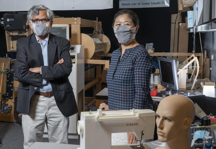<p>Georgia Tech professor Sundaresan Jayaraman and principal research scientist Sungmee Park wear prototypes of their redesigned face mask. (Credit: Christopher Moore, Georgia Tech).</p>