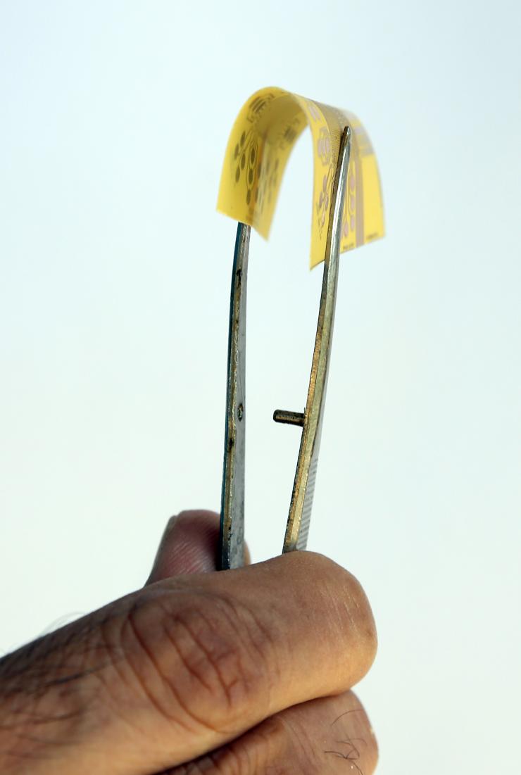 <p>Flexible electronics are circuits and systems that can be bent, folded, stretched or conformed without losing their functionality. Hybrid electronics involves a mix of elements such as logic, memory, sensors, batteries, antennas, and various passives which may be printed or assembled on flexible substrates. (Credit: Candler Hobbs, Georgia Tech)</p>