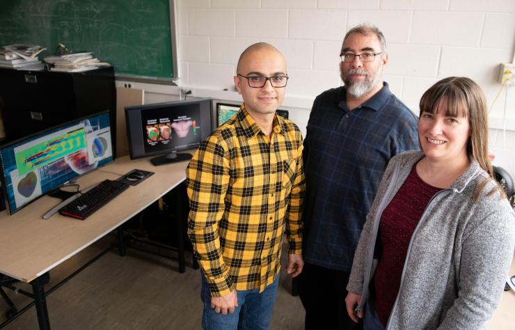 <p>Researchers have developed a system that uses graphics processing chips designed for gaming applications and software that runs on ordinary web browsers to produce simulations that formerly required high-powered computers. Shown are Abouzar Kaboudian, Flavio Fenton and Elizabeth Cherry. (Photo: Allison Carter, Georgia Tech)</p>