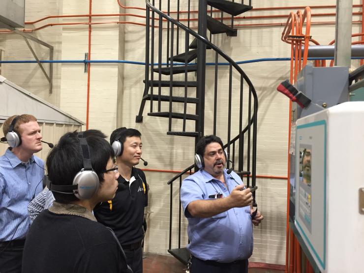 <p class="p1">Scott Duncan, reearch engineer; Linyu Zhang, graduate student; Jung-Ho Lewe, research engineer; and Wesley Harding, stationary engineer, tour the Holland Heating and Cooling Plant.</p>