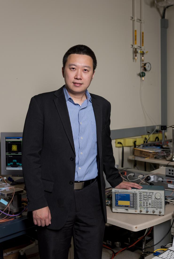 <p>Georgia Tech Assistant Professor Hua Wang is shown in his laboratory. Wang leads a research team developing a novel cellular sensing platform that promises to expand the use of semiconductor technology in the development of next-generation bioscience and biotech applications. (Georgia Tech Photo: Rob Felt).</p>