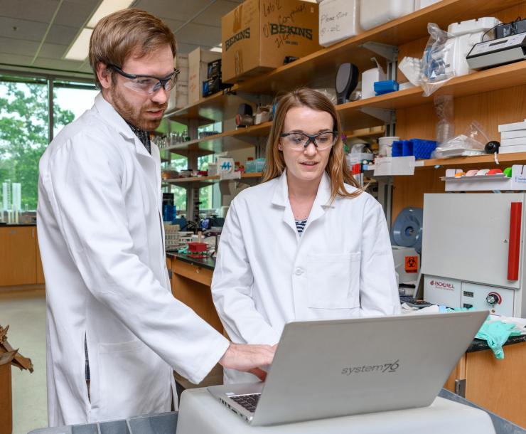 <p>Research Scientist Dan Cornforth and Postdoctoral Fellow Carolyn Ibberson are shown in the laboratory of Professor Marvin Whiteley at Georgia Tech. They are part of a research team studying differences in how bacteria behave in laboratory conditions compared to in human infections. (Credit: Rob Felt, Georgia Tech)</p>