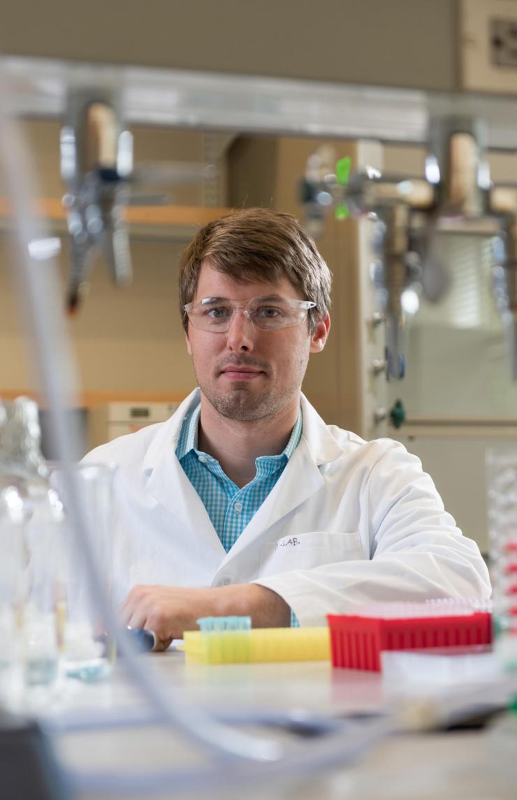 <p>James Dahlman, an assistant professor in the Wallace H. Coulter Department of Biomedical Engineering at Georgia Tech and Emory University, is shown in his laboratory. (Credit: Christopher Moore, Georgia Tech)</p>