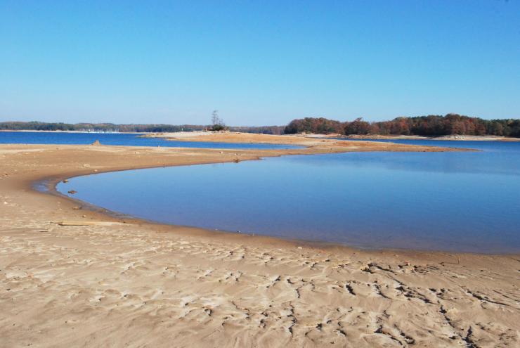 <p>When Lake Lanier’s water level drops below a certain point, calls go out for water conservation. The combination of usage restrictions and changes in precipitation eventually averts the crisis. But, when the crisis ends, water usage rebounds – until the next shortage. This photo shows conditions from the 2007 drought. (Credit: Ed Jackson)</p>