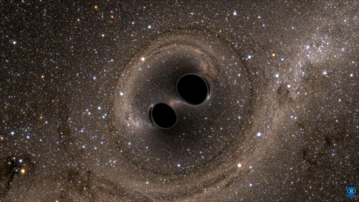 <p>The collision of two black holes holes—a tremendously powerful event detected for the first time ever by the Laser Interferometer Gravitational-Wave Observatory, or LIGO—is seen in this still from a computer simulation. <em>Image Credit: SXS, the Simulating eXtreme Spacetimes (SXS) project</em></p>