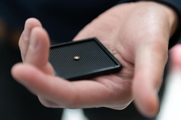 <p>Georgia Tech researchers have developed an ultra-low power hybrid chip inspired by the brain that could help give palm-sized robots the ability to collaborate and learn from their experiences. (Photo: Allison Carter, Georgia Tech)</p>