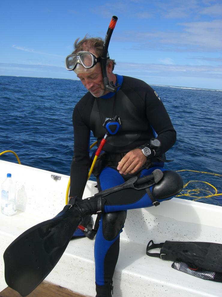 <p>Georgia Tech Teasley Professor Mark Hay prepares for a dive off the coast of the Fiji Islands. (Credit: Julia Kubanek, Georgia Tech)</p>