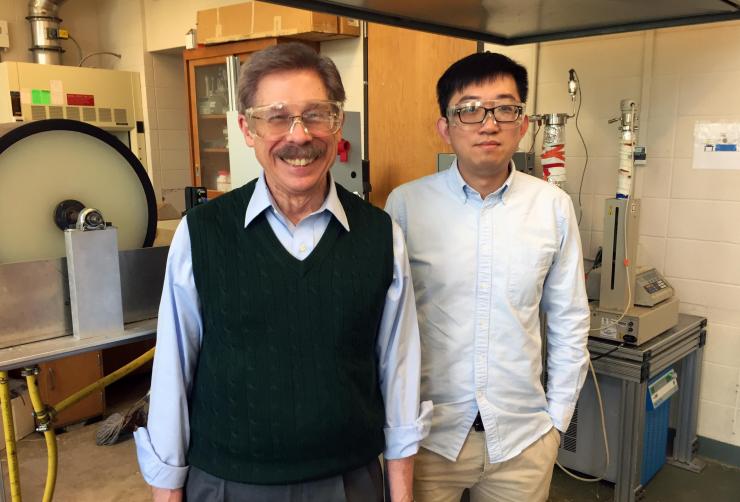 <p>Georgia Tech professor William J. Koros and research engineer Chen Zhang are shown with a dry-wet hollow fiber spinning system. (Credit: John Toon, Georgia Tech)</p>