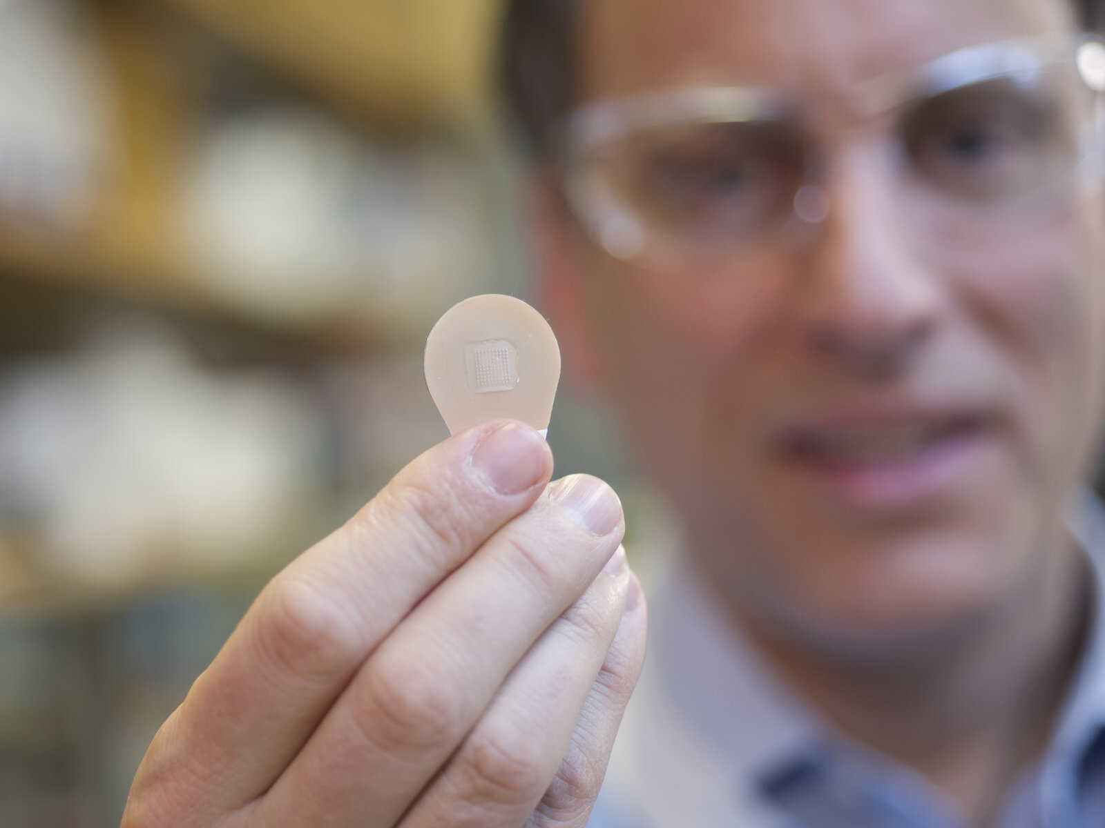 Mark Prausnitz, Georgia Tech Regents&#039; professor in the School of Chemical and Biomolecular Engineering, holds a vaccine patch containing microneedles that dissolve into the skin.