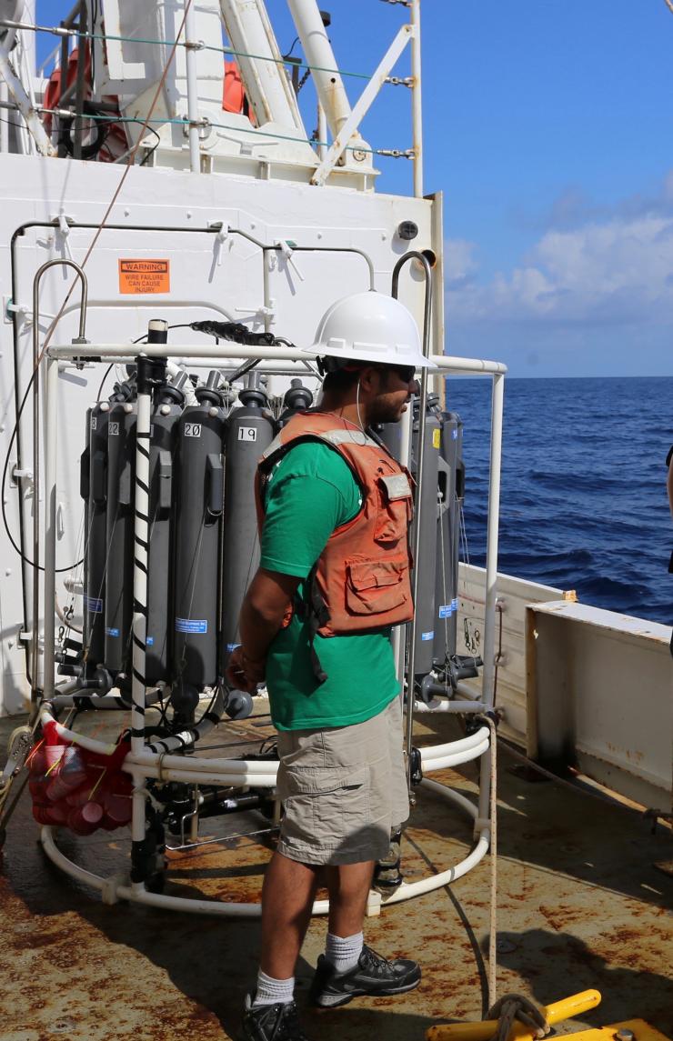 <p>Postdoctoral researcher Nigel D’Souza prepares to deploy the CTD-rosette used for sampling the water column in the Gulf of Mexico. (Credit: Joe Montoya, Georgia Tech)</p>