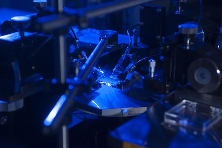 <p>Georgia Tech researchers have developed a new higher efficiency rectenna design. Here, the device’s ability to convert blue light to electricity is tested. (Credit: Christopher Moore, Georgia Tech)</p>