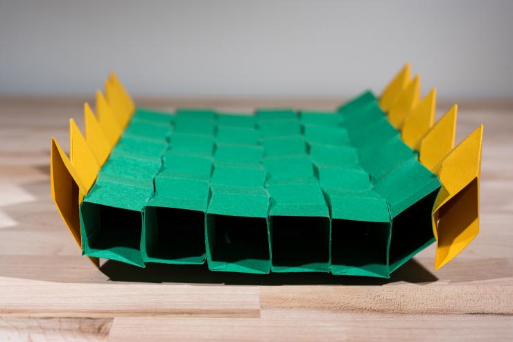 <p>This origami bridge is made by combining multiple zippered tubes. Though made from paper, it can support a significant load. The structure could serve as a model for full-sized bridges that could be folded for delivery to disaster areas and then quickly expanded to full size. (Credit: Rob Felt, Georgia Tech)</p>