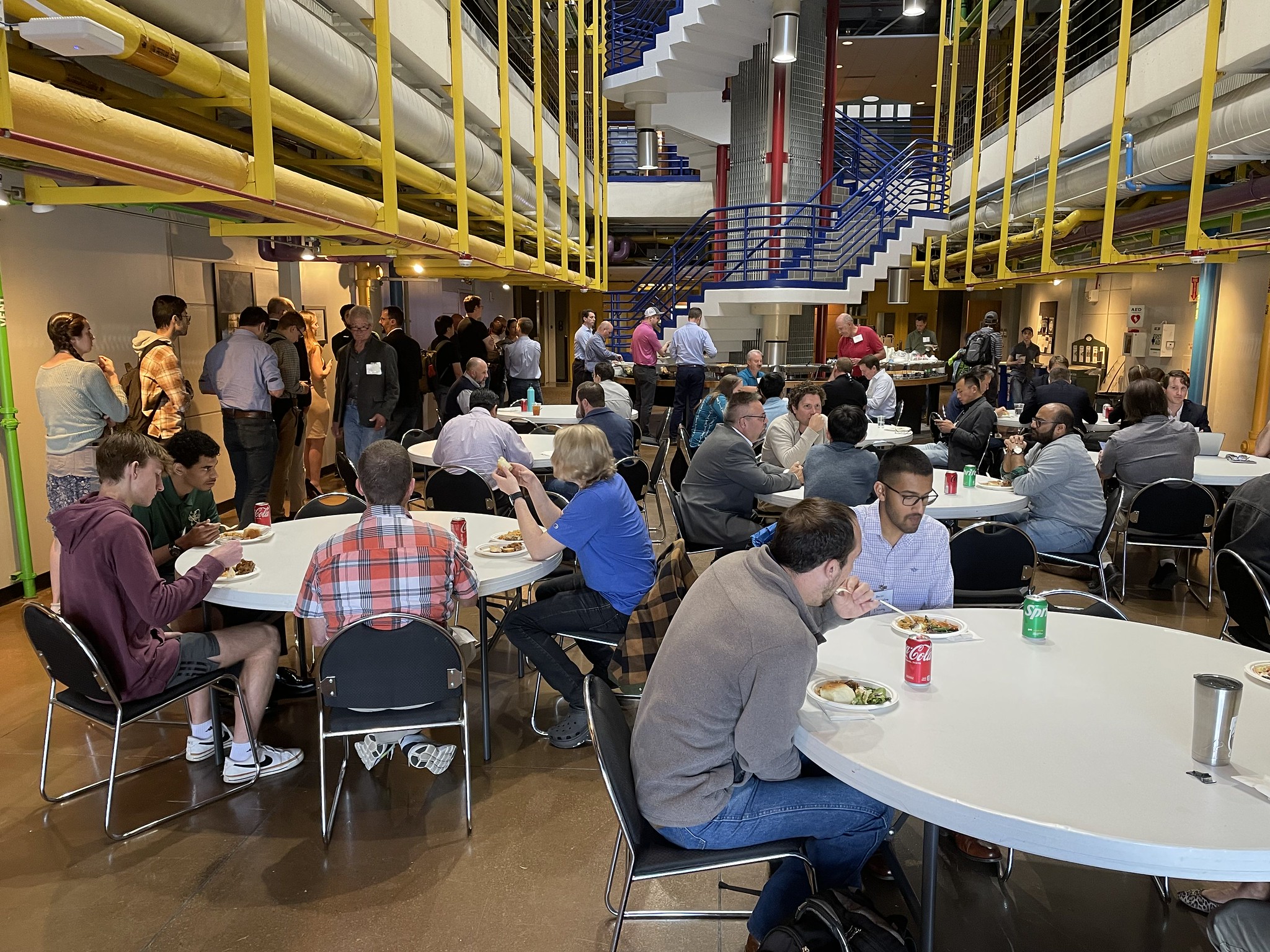 IoTfM participants enjoy lunch in the GTMI/Callaway Research building atrium.