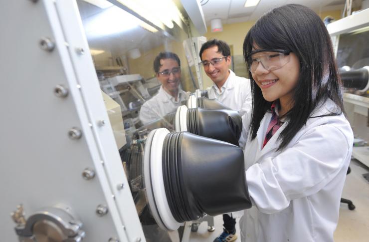 <p>Graduate students Felipe Larrain and Wen-Fang Chou testing the performance of the single layer solar cells developed at Georgia Tech using a new electrical doping technique. (Credit: Christopher Moore, Georgia Tech)</p>