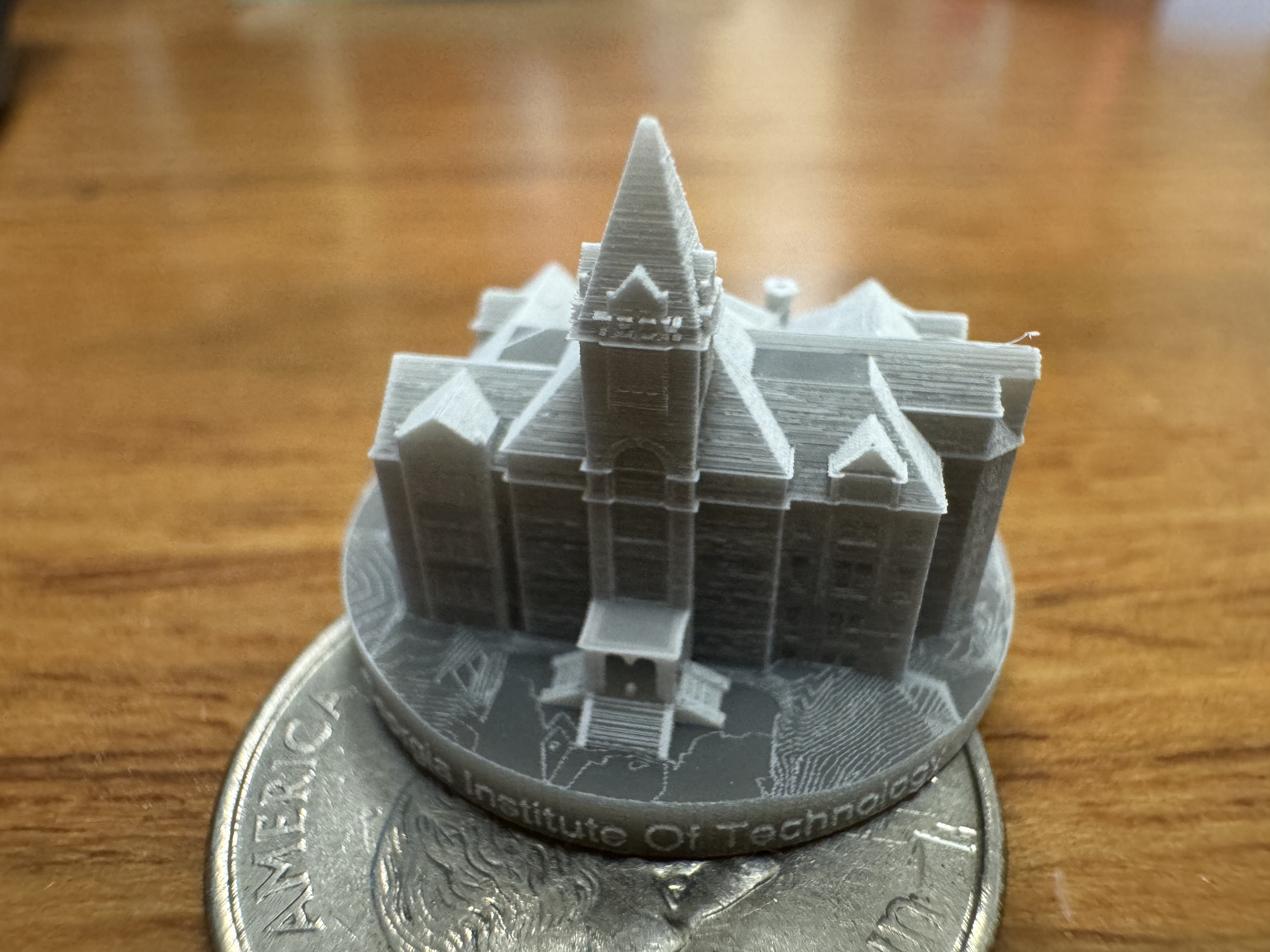 3D printed Tech Tower sitting on a coin using the new printer.