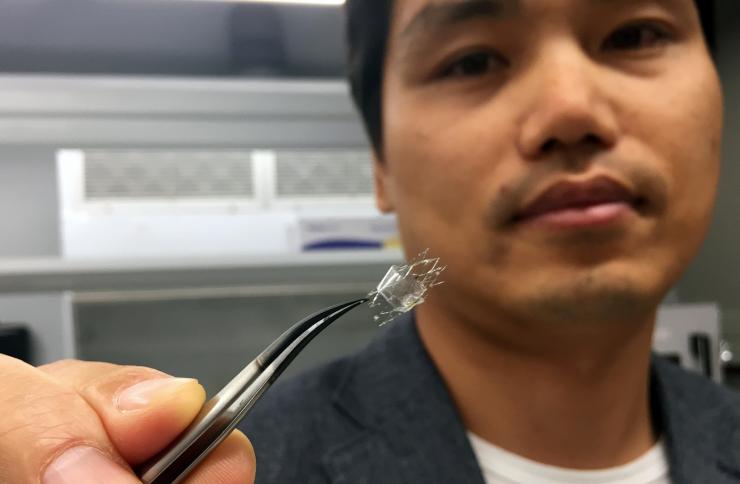 <p>Woon-Hong Yeo, an assistant professor in Georgia Tech’s George W. Woodruff School of Mechanical Engineering and Wallace H. Coulter Department of Biomedical Engineering, holds a flow sensor on a stent backbone. (Credit: John Toon, Georgia Tech)</p>