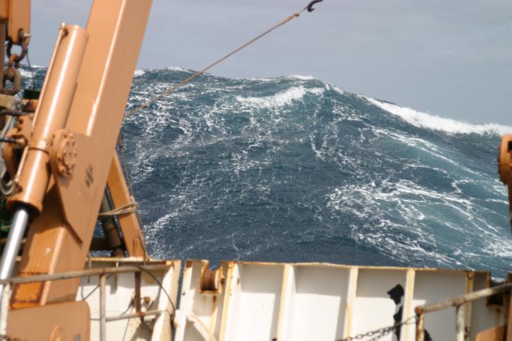 <p>A large wave towers astern of the NOAA ship DELAWARE II in the Atlantic Ocean in 2005. (Credit: Personnel of NOAA ship DELAWARE II)</p>