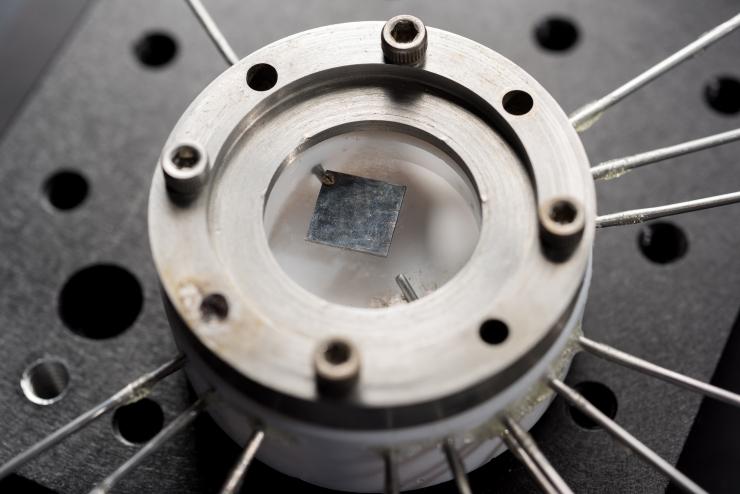 <p>Shown is a sample holder used to test samples of lithiated silicon to determine its nano-mechanical properties. The device was used to develop a detailed nano-mechanical study of mechanical degradation processes in silicon thin films. (Credit: Rob Felt, Georgia Tech)</p>