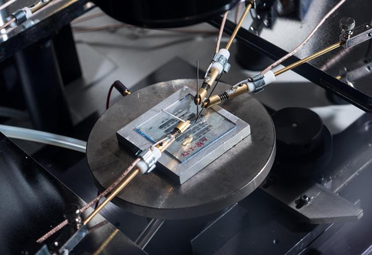 <p>Image shows organic-thin film transistors with a nanostructured gate dielectric under continuous testing on a probe station. (Credit: Rob Felt, Georgia Tech)</p>