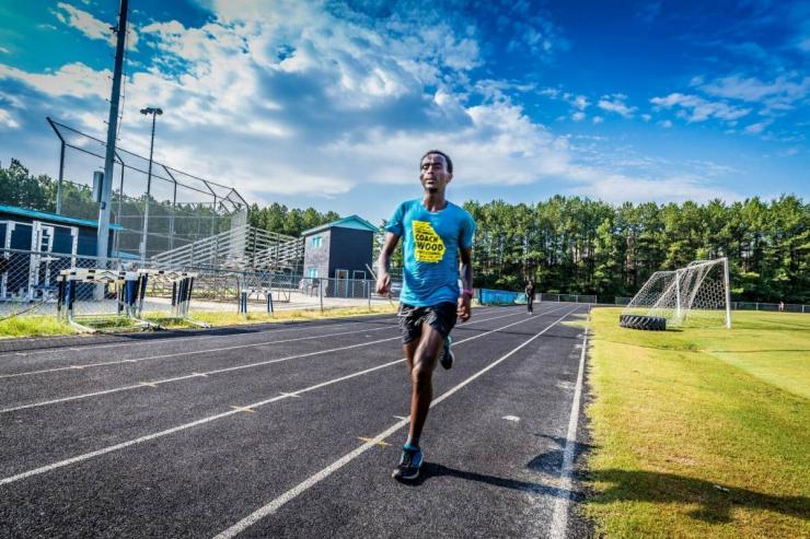 <p>Biya Haile running cross country in high school </p>