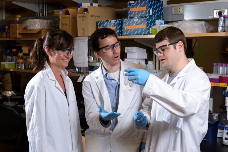 <p>Georgia Tech researchers have engineered a bacterium to produce different pigments in response to varying levels of a micronutrient in blood samples. Shown are (left to right) graduate assistant Monica McNerney, assistant professor Mark Styczynski and graduate assistant Daniel Watstein. (Credit: Rob Felt, Georgia Tech)</p>