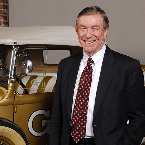 Portrait of Ray C. Anderson in front of the Tech Wreck, Model A Ford..