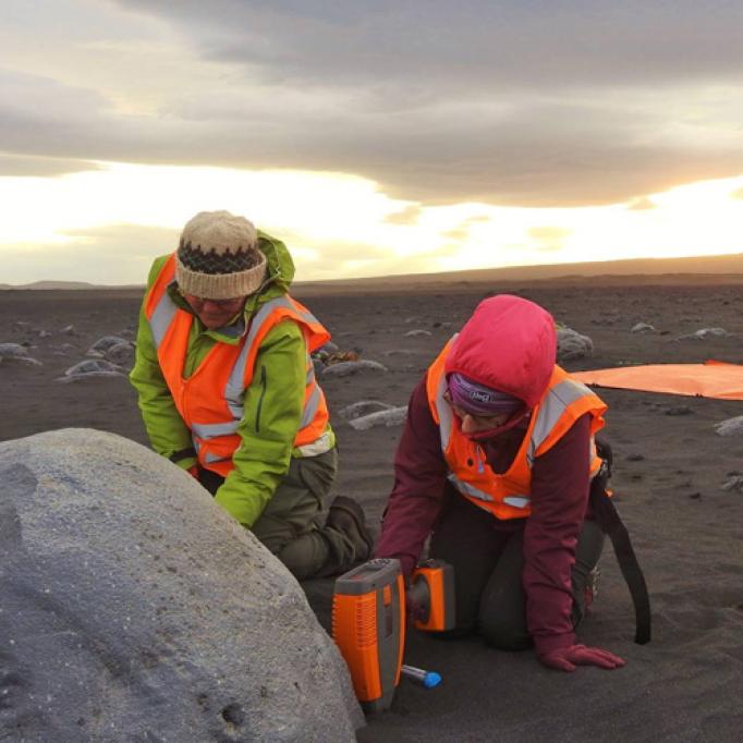 Students using handheld portable chemical analysis instrumentation analogous to those used on Mars.