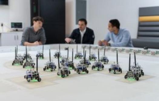 Students in a swarm robotics lab at GT