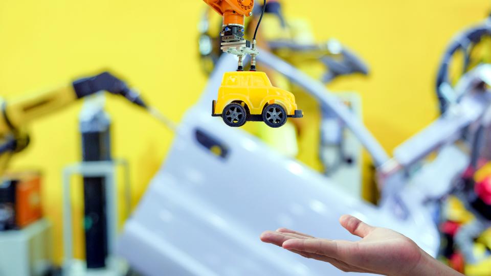 toy production into the hands of a person