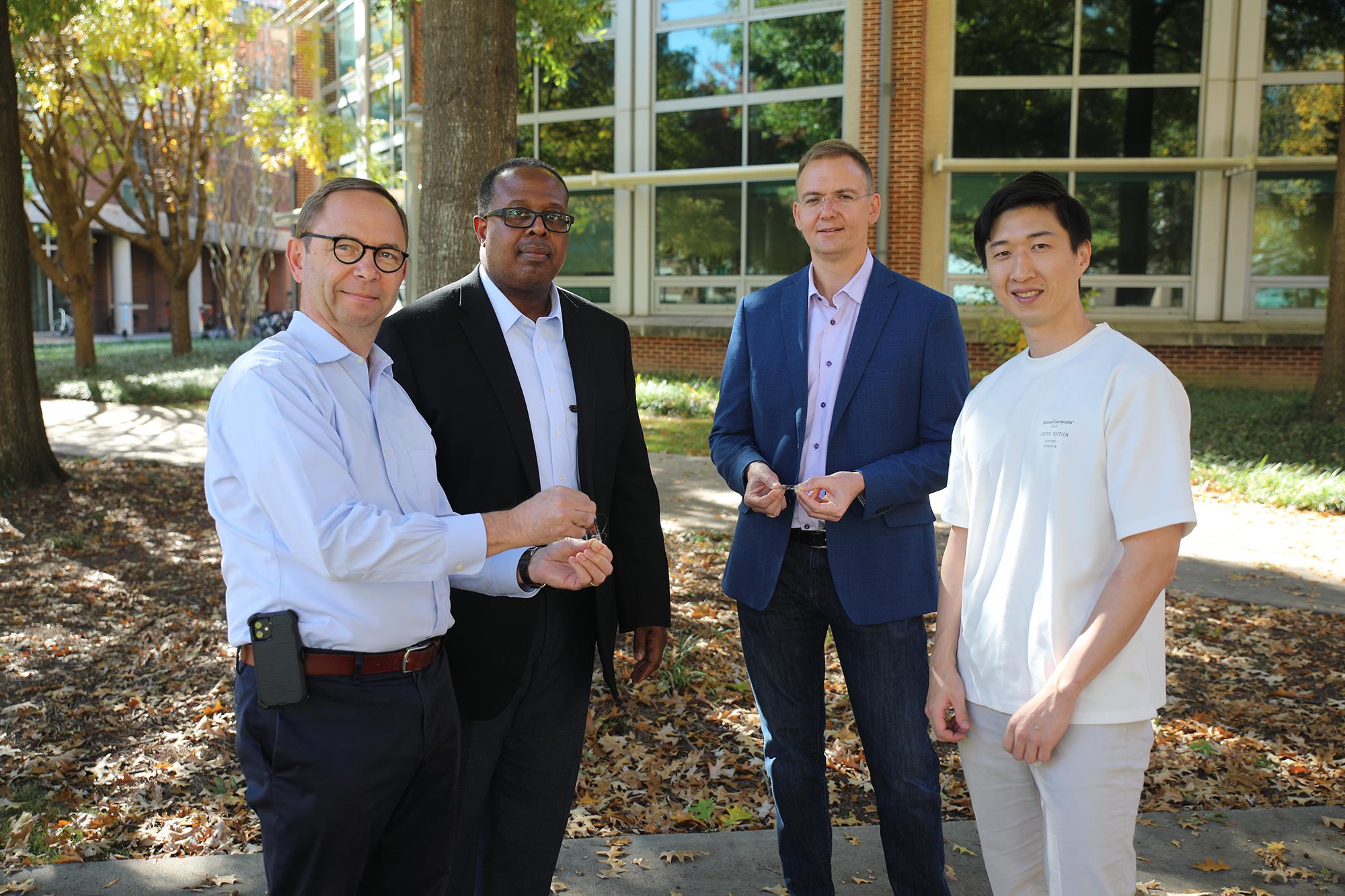 Three engineering labs at Georgia Tech collaborated to demonstrate a new level of stretchability of a photodetector. Pictured above is first author Youngrak Park (right) with the lab leads (L to R) Bernard Kippelen,  Samuel Graham, and Olivier Pierron. (Photo credit: Ben Wright, Georgia Tech)