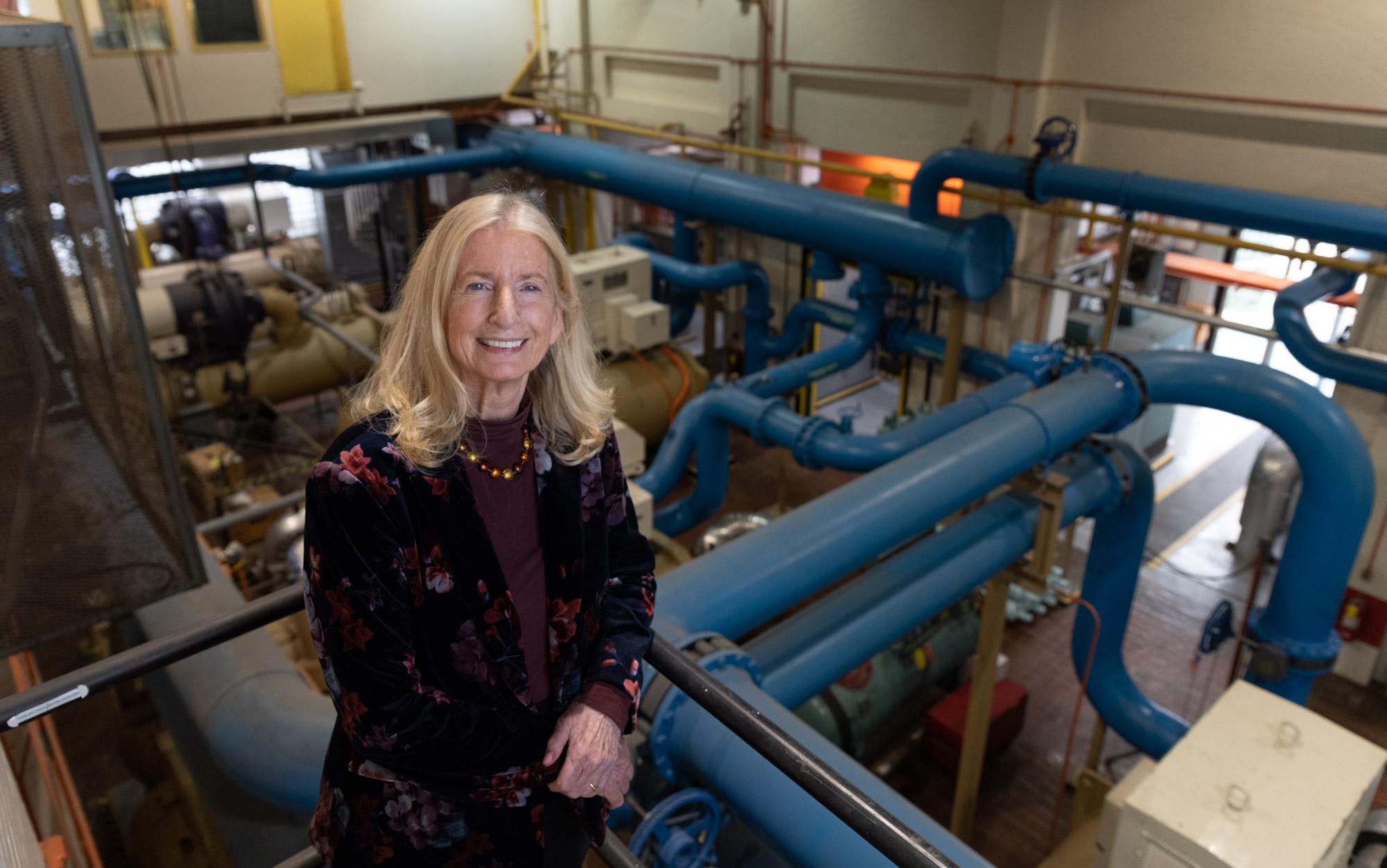 The study’s principal investigator, Marilyn Brown, at the district heating and cooling plant in the heart of Georgia Tech’s campus. While Georgia Tech is not yet operating a CHP system, it is currently examining options for lessening the campus’s energy footprint. (Photo credit: Robert Felt, Georgia Tech) 
