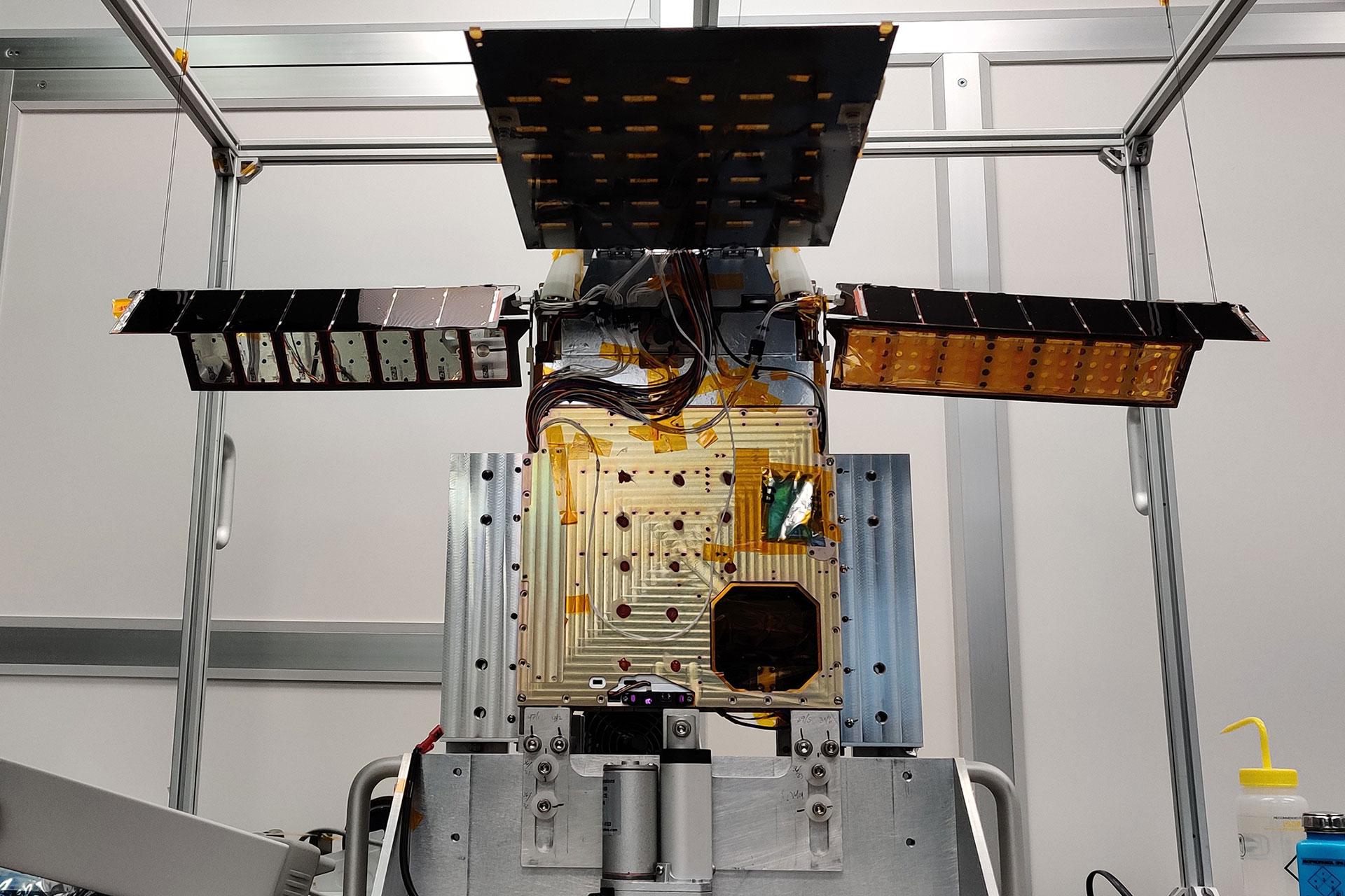 The Lunar Flashlight is shown here at the end of the solar array deployment test. The solar arrays will be stowed for launch and will automatically deploy when the spacecraft is released. (Credit: Conner Awald)