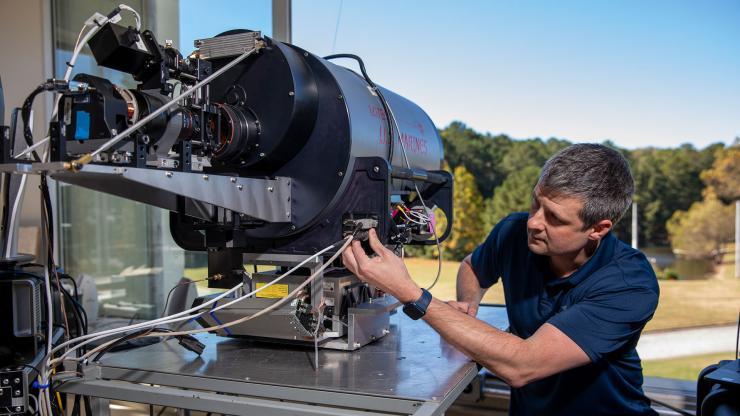 <p>GTRI Research Engineer Brandon Vaughn leads the Bullet Time project. Vaughan noted that the intent of Bullet Time is to stretch the boundaries of how LIDAR systems can be used (Credit: Sean McNeil, GTRI)</p>