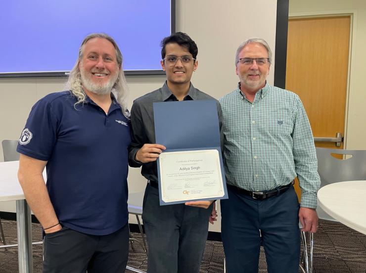 <p><strong>Pictured: </strong>Aditya Singh, an undergraduate computer engineering student in the College of Engineering and CIC winner (middle). Matt Sanders (left-side) and Russell Clark (right-side). Sanders and Clark are key faculty organizers of the Georgia Tech Convergence Innovation Competition (CIC).</p>