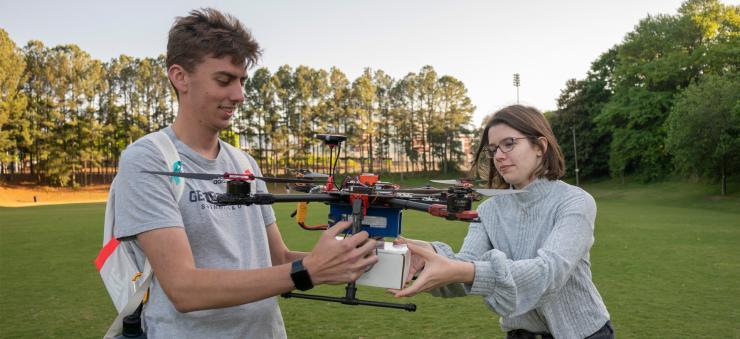 <p>Catherine Heaton (right) is a fourth-year aerospace engineering major who has participated in Experimental Flights since fall 2020. Heaton said she enjoys working with a diverse group of students to solve real-world issues (Credit: Christopher Moore, GTRI).</p>
