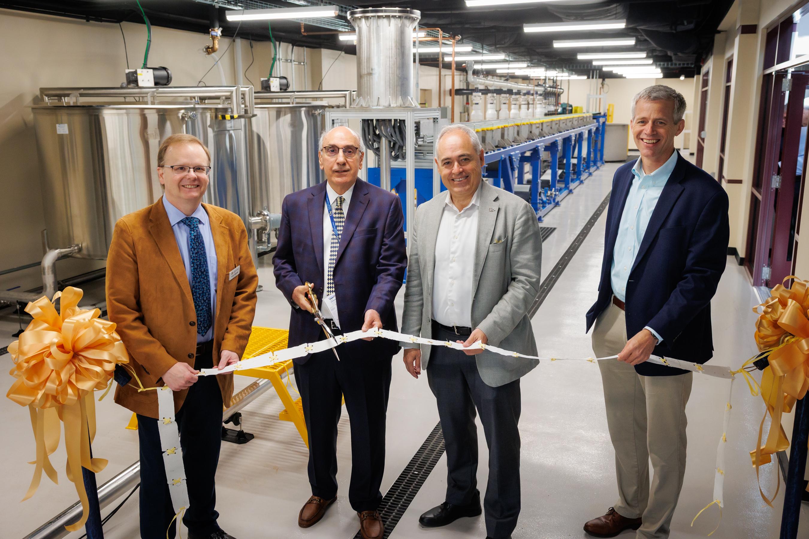 4 gentlemen cutting grand opening ribbon