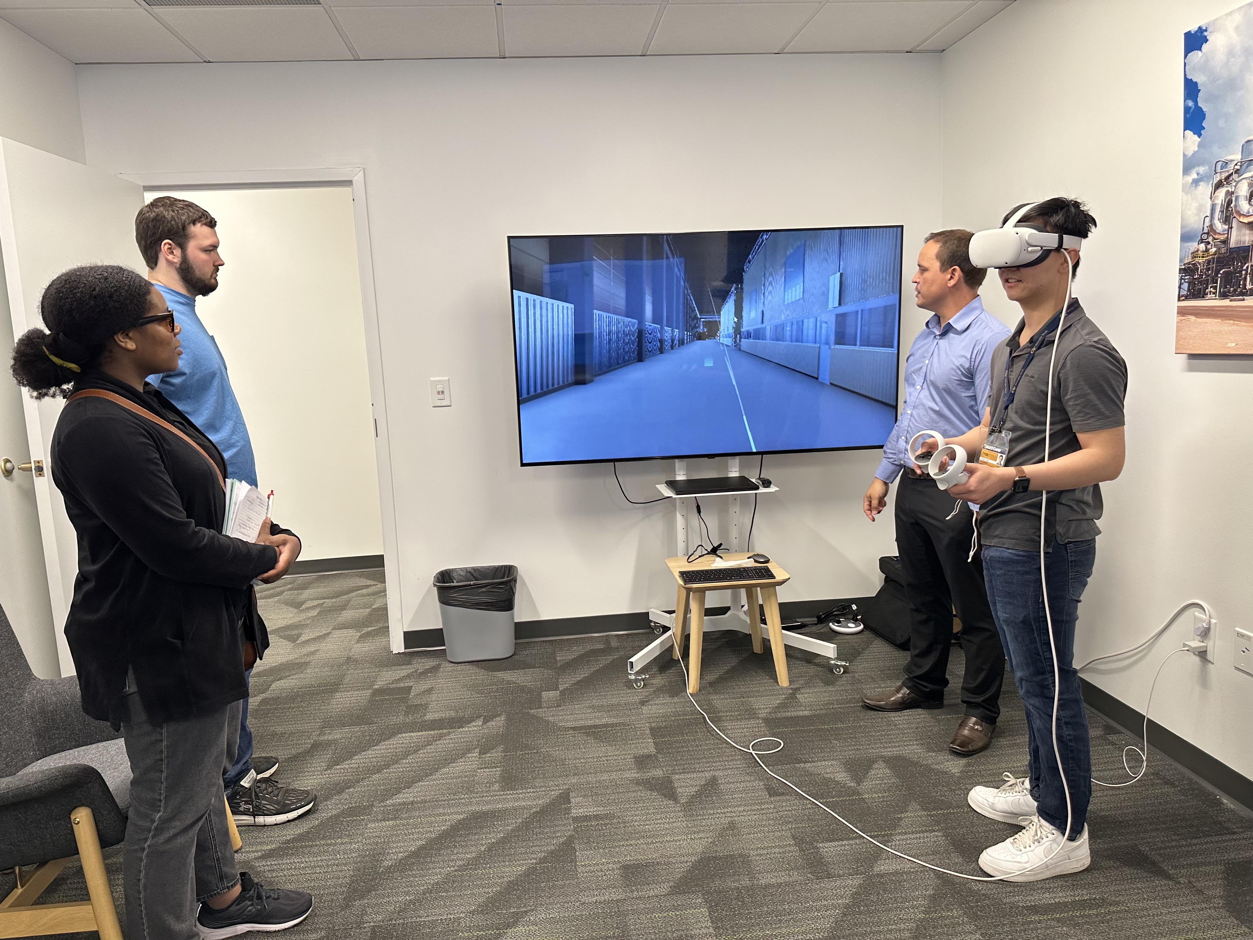 Georgia Tech student trying the virtual reality software systems at the Valmet Lab
