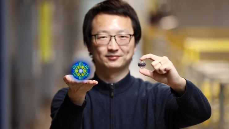 <p>Researcher Xiaojian Bai and his colleagues used neutrons at ORNL’s Spallation Neutron Source to discover hidden quantum fluctuations in a rather simple iron-iodide material discovered in 1929. The research suggests many similar magnetic materials could have quantum properties that are waiting to be discovered. (Credit: ORNL/Genevieve Martin)</p>
