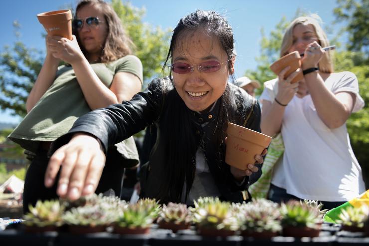 <p>Students select succulents at a 2018 Earth Day event. Photo by Allison Carter</p>