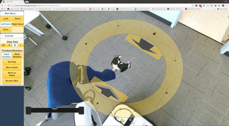 <p>Image shows the view through the PR2’s cameras showing the environment around the robot. Clicking the yellow disc allows users the control the arm. (Credit: Phillip Grice, Georgia Tech)</p>