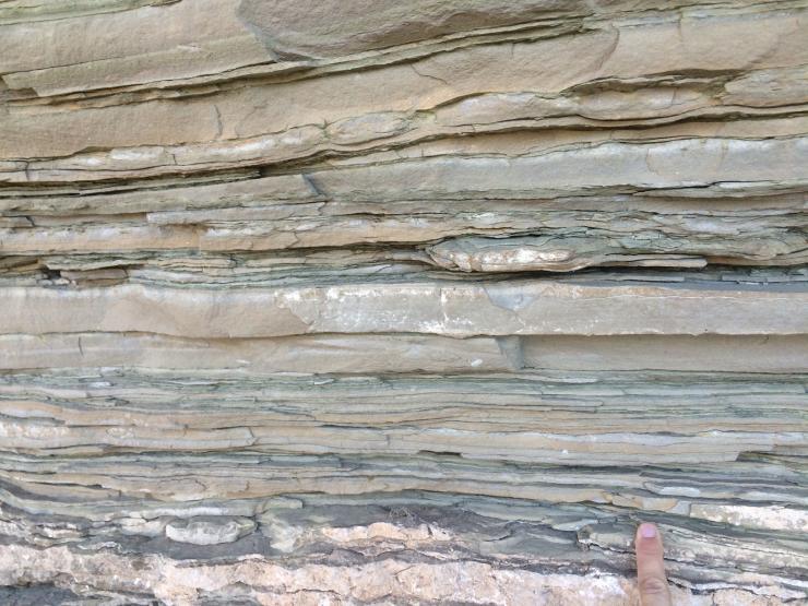 <p>Close-up view of layered sedimentary rocks representative of those used in this study. Each layer records a snapshot of the Earth system over millions to billions of years. Credit: Georgia Tech / Yale - Reinhard / Planavsky</p>