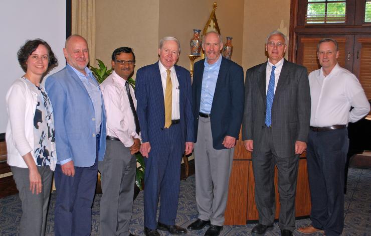 <p>REM leadership lines up with honored guests during a break in the action at the REM retreat. Pictured are (left to right) Johnna Temenoff, Ned Waller, Krish Roy, J. David Allen, Carl June, Mike Cassidy, and Steve Stice.</p>