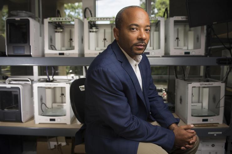 <p>Raheem Beyah, the Motorola Foundation Professor and associate chair in Georgia Tech’s School of Electrical and Computer Engineering, is shown in a 3-D printing lab at the Woodruff School of Mechanical Engineering. (Credit: Christopher Moore, Georgia Tech)</p>
